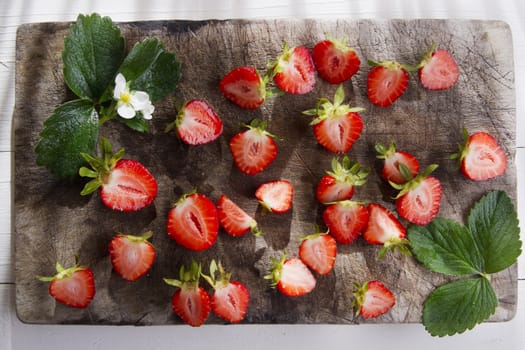 Small pieces of strawberries for the preparation of salad 