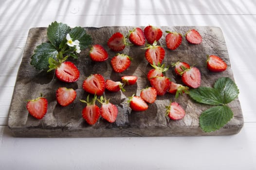 Small pieces of strawberries for the preparation of salad 