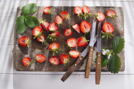 Small pieces of strawberries for the preparation of salad 