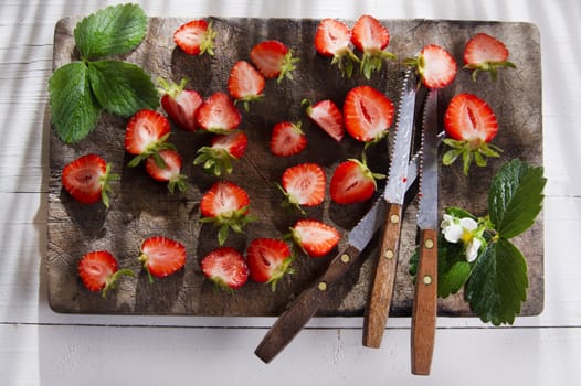 Small pieces of strawberries for the preparation of salad 