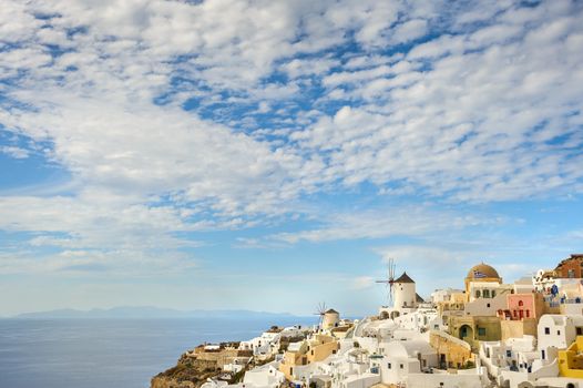 Famous view of Oia village at the Island Santorini, Greece. Before sunset. Huge copyspace.