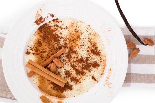 Delicious porridge breakfast with cinnamon and cocoa powder. Traditional breakfast eating. 