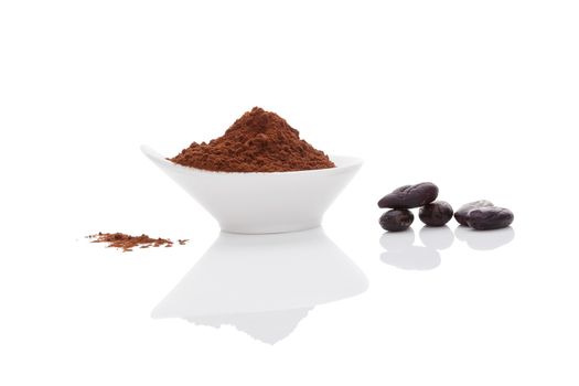 Cocoa beans and cocoa powder on white background. Healthy superfood.