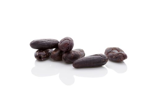 Cocoa beans isolated on white background. Healthy superfood.