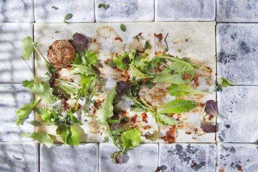 What remains at the end of a dish of vegetables and meat