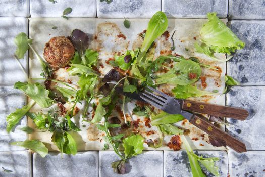 What remains at the end of a dish of vegetables and meat