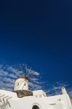 View of Oia windmill at the Island Santorini, Greece. Natural Gradient, lot of copyspace.