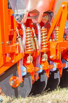 Close up new tractor plow in farm