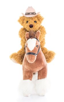 Cowboy Teddy bear riding a horses on white background