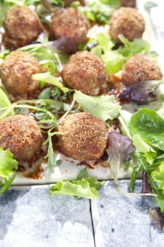 Second dish of meatballs and green salad