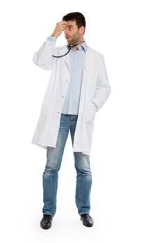 Humorous portrait of a young depressed surgeon with a stethoscope, isolated on white