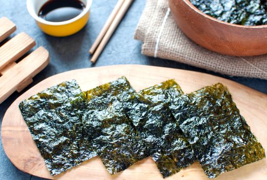 Seaweed wafer snacks on a wooden board 