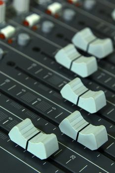 Closeup buttons equipment in audio mixing console