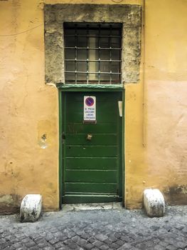 front view of a vintage doorway in Rome, italy