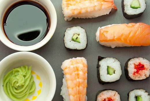 Closeup of sushi prawns, salmon and vegetables with rice