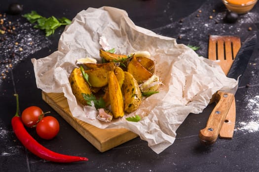 Homemade fries on a table with ingredients and cutlery around. Concept: healthy food, diet, fastfood. 