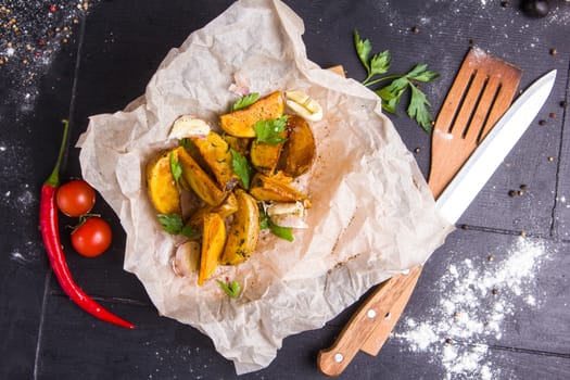 Homemade fries on a table with ingredients and cutlery around. Concept: healthy food, diet, fastfood. 