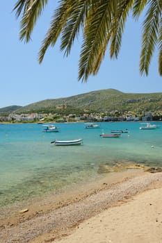 Porto Rafti harbor view with beach and fisher boats during springtime, Greece