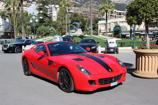 Monte-Carlo, Monaco - March 9, 2016: Red Ferrari 430 Scuderia Parked in Front of the Monte-Carlo Casino in Monaco