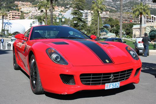Monte-Carlo, Monaco - March 9, 2016: Red Ferrari 430 Scuderia Parked in Front of the Monte-Carlo Casino in Monaco