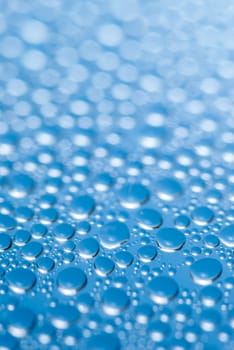 close-up of water drops on the blue background.