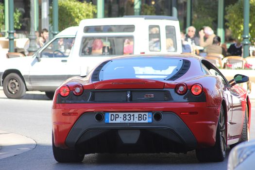 Monte-Carlo, Monaco - March 9, 2016: Red Ferrari 430 Scuderia (rear view) Parked in Front of the Monte-Carlo Casino in Monaco