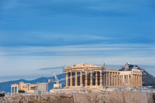 Ancient Acropolis in rays of sunset. Athens Greece. Copyspace.