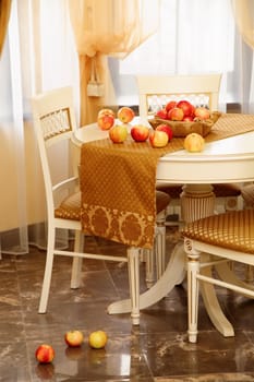 table with apples and chairs in the beautiful room
