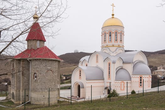 Varvarovka, Russia - March 15, 2016: New and old church in the village of Great Martyr Barbara Varvarovka, a suburb of Anapa, Krasnodar Krai