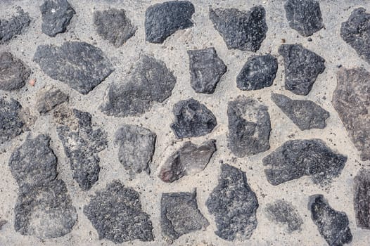 Rough random shaped stones pavement texture background
