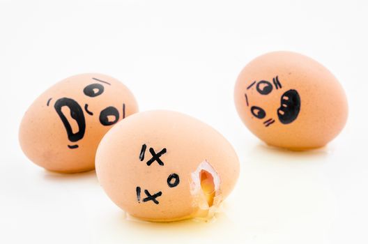 Egg with a painted human face feel sick on white background. Be tipsy concept.
