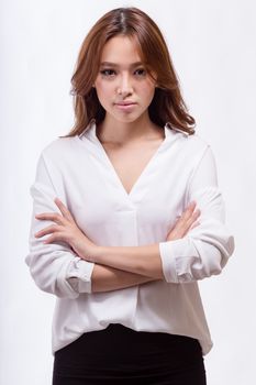 Asian American businesswoman with crossed arms looking at camera