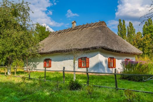 Ancient traditional ukrainian rural cottage with a straw roof. 