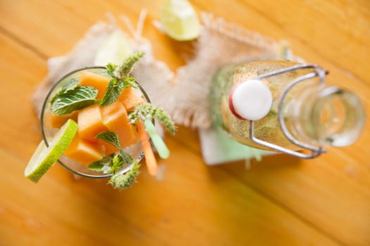 Presentation of the aperitif made from fruit, melon and mint 