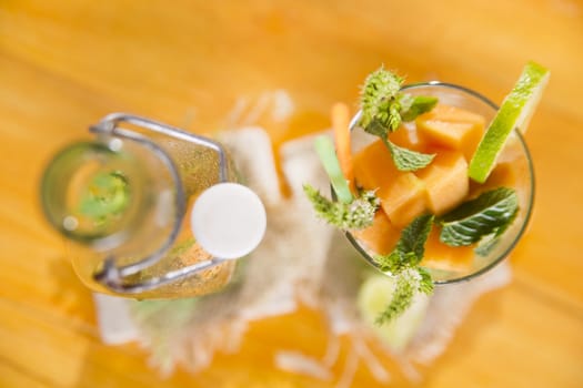 Presentation of the aperitif made from fruit, melon and mint 