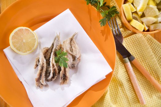 Presentation of a seafood platter, fried anchovies 