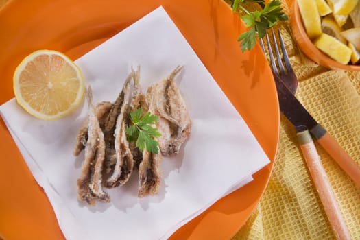 Presentation of a seafood platter, fried anchovies 