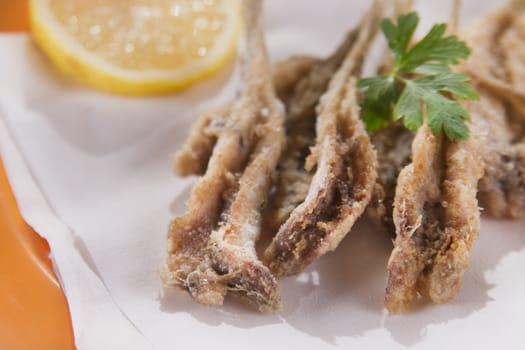 Presentation of a seafood platter, fried anchovies 