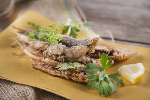 Presentation of a seafood platter, fried anchovies 