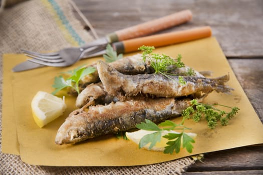 Presentation of a seafood platter, fried anchovies 