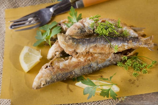 Presentation of a seafood platter, fried anchovies 