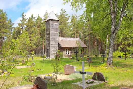 Old wooden chapel and cemetery in Malvaste village. Hiiumaa island, Estonia
Very old country church in Estonia with old cemetery in foreground. Late afternoon light.