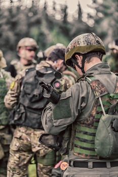 men in military uniform with weapon on a mission