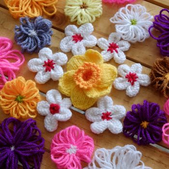 Group of handmade craft for mother day, colorful daisy flower on wood background, ornament make from yarn