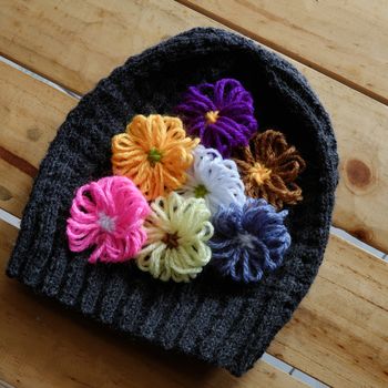 Group of handmade craft for mother day, colorful daisy flower on wool background, ornament make from yarn