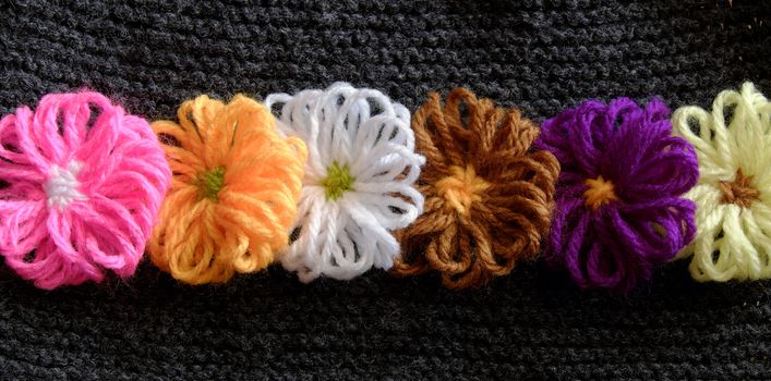 Group of handmade craft for mother day, colorful daisy flower on wool background, ornament make from yarn