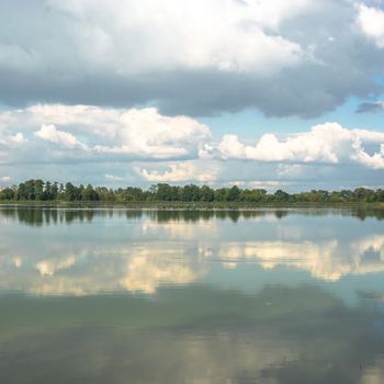 blue lake with cloudy sky, nature series