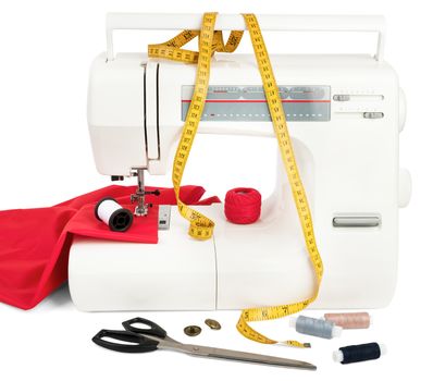 Sewing machine with red fabric, threads and scissors isolated on white background