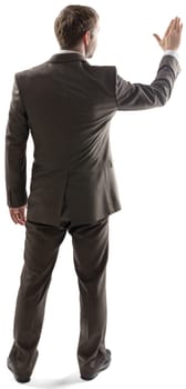 Rear view of young business man touching at copy space isolated over white background. Full length portrait of businessman standing back