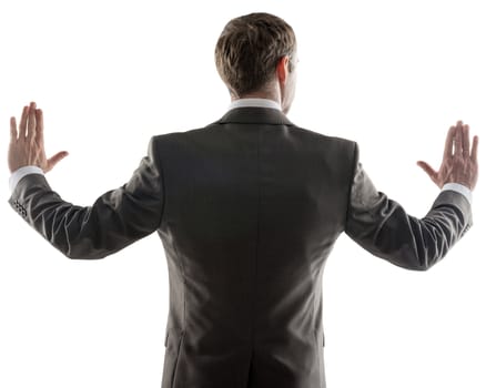 Rear view of young business man pointing at copy space isolated over white background, portrait of businessman standing back